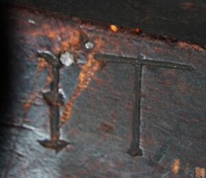 Close up of Initials I.T. engraved on musket