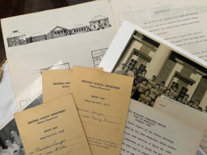 Documents from a folder laid out on a table