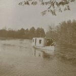 Old riverboat on river