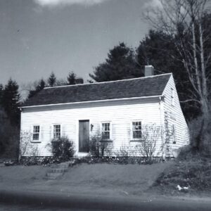 white 1730s home with center door and two windows on each side