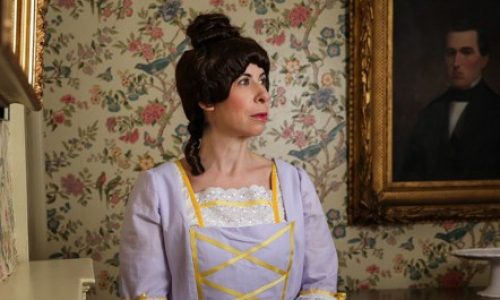 Woman dressed in colonial gown